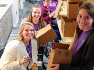 Students packing boxes
