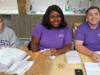 students preparing napkins