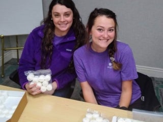 students bagging candles