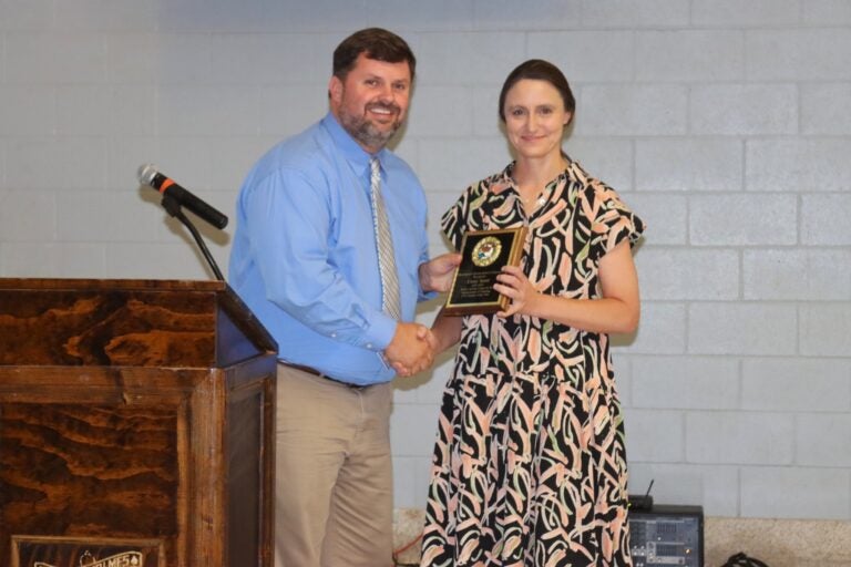 Casey Spear receives and award for teaching excellence.
